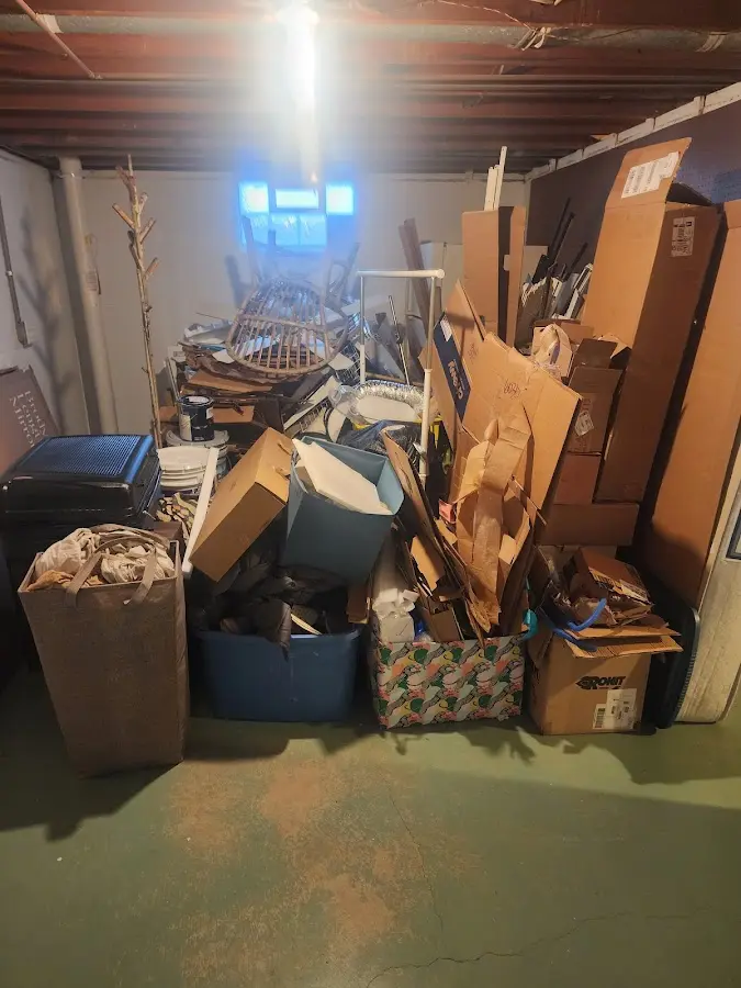 Roll-off dumpster container at job site for 2 Yard Dumpster Rental in Lee's Summit