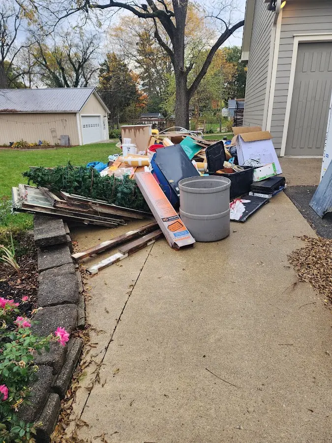 Dumpster being loaded with debris for Demolition Dumpster Rental in Lee's Summit
